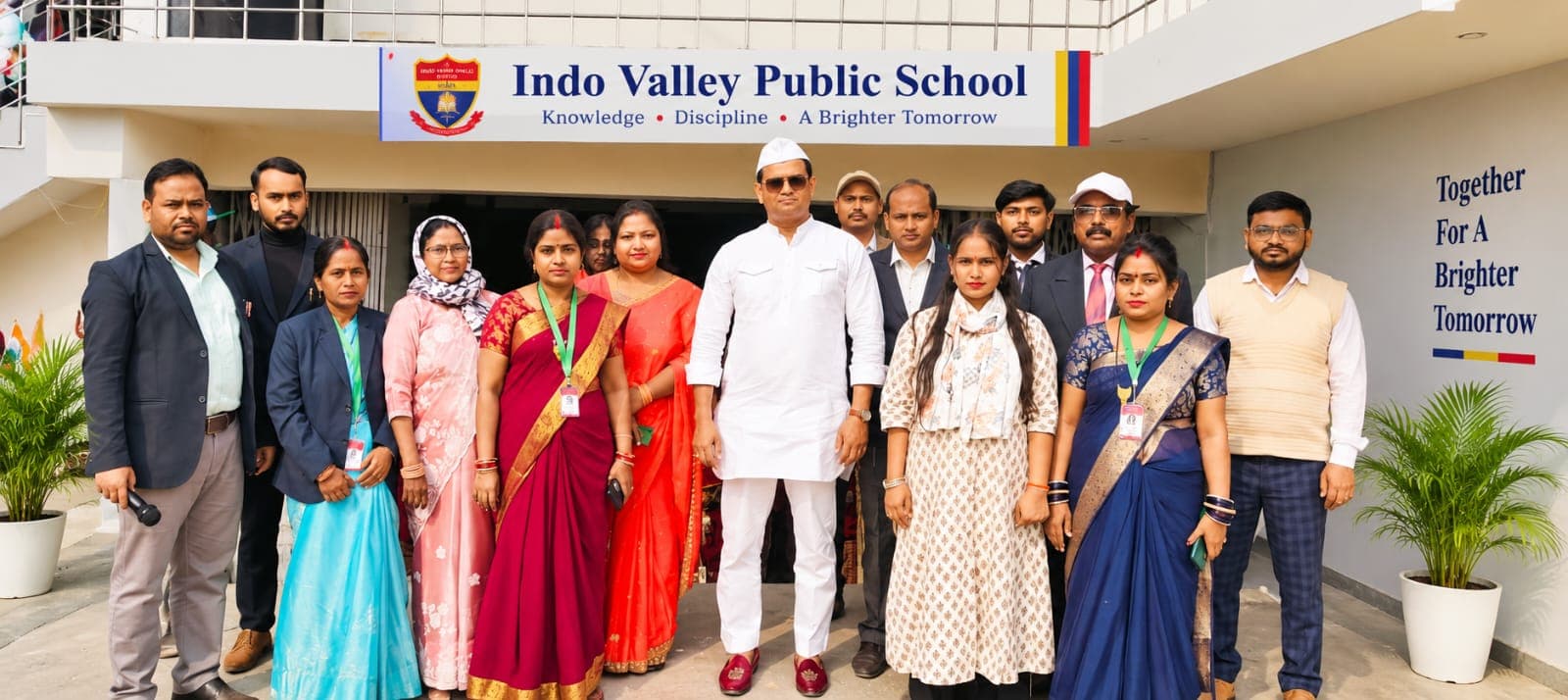 Teachers and staff of Indo Valley Public School gathered outside the school building